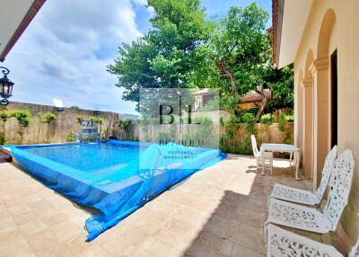 Outdoor area with a swimming pool and seating