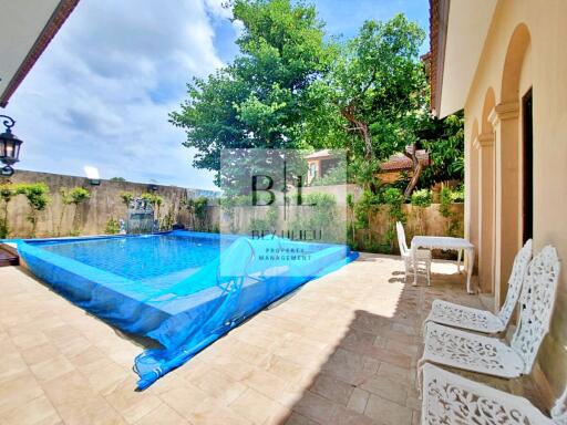 Outdoor area with a swimming pool and seating