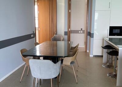 Modern dining area with a table and chairs