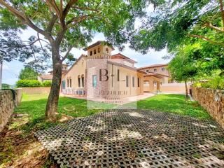 Exterior view of a house with a lush green yard