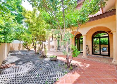 Beautiful courtyard with lush greenery and arches