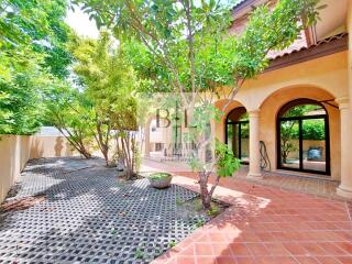 Beautiful courtyard with lush greenery and arches