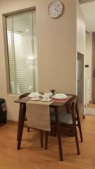 Cozy dining area with wooden table and chairs