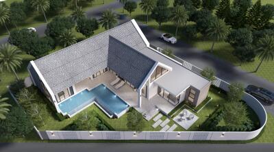 Aerial view of a modern house with a swimming pool and surrounding greenery