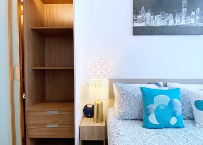 Cozy bedroom with modern decor and shelving