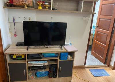 Living room with TV and storage unit