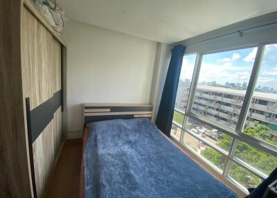 Bedroom with large window and wardrobe