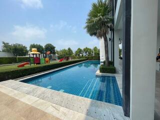 Outdoor swimming pool with playground