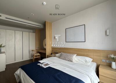 Modern bedroom with wooden accents and built-in storage