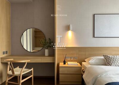 Modern bedroom with wooden furniture and a round mirror