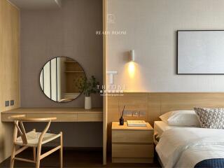 Modern bedroom with wooden furniture and a round mirror