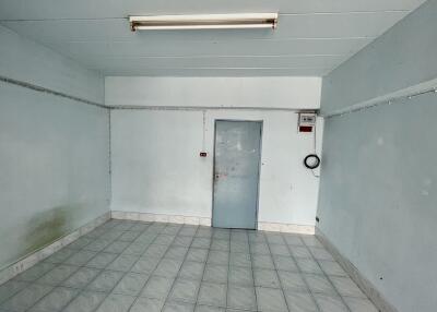 Empty room with tiled floor and door
