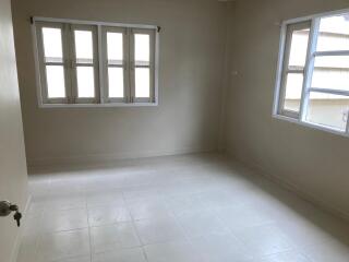 Empty bedroom with windows