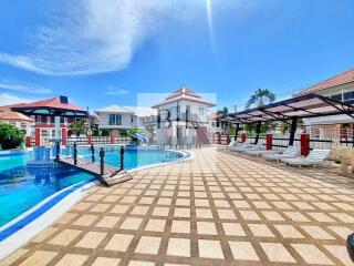 Beautiful outdoor pool area with sun loungers and deck.