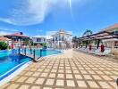 Beautiful outdoor pool area with sun loungers and deck.