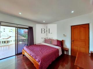 Spacious bedroom with balcony view