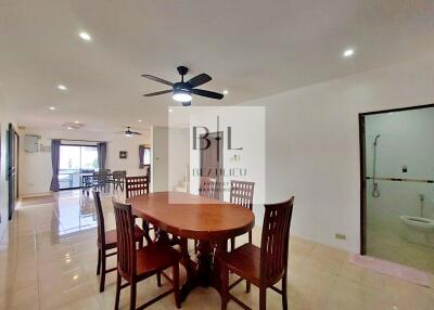 Spacious dining area with wooden furniture