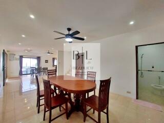 Spacious dining area with wooden furniture