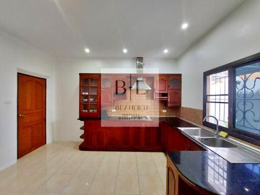 Modern kitchen with wooden cabinets and island