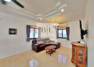 Spacious living room with modern ceiling design