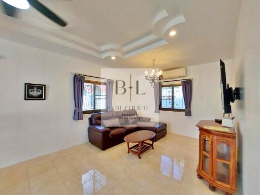 Spacious living room with modern ceiling design