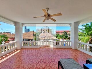 Spacious balcony with ceiling fan and city view