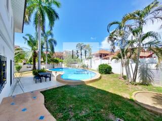 Backyard with pool and palm trees