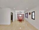 Spacious dining area with a wooden dining table set and nautical decor