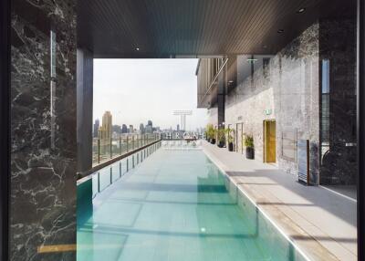 Luxury building with an indoor swimming pool and city view