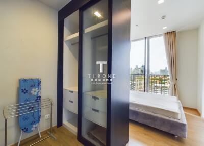 Bedroom with glass wardrobe and balcony