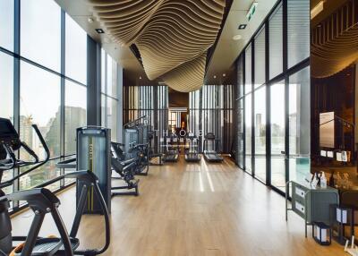 Modern gym with city view and gym equipment