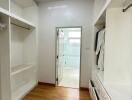 Spacious walk-in closet with hanging rods and shelving