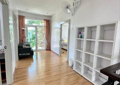 Bright hallway with wooden flooring