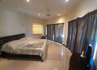 A spacious bedroom with ample natural light