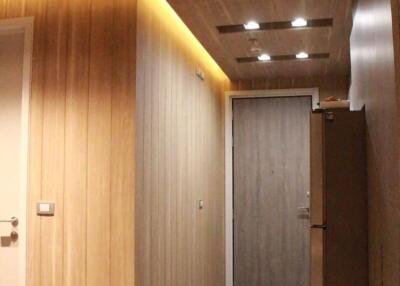 Modern wooden hallway with recessed lighting