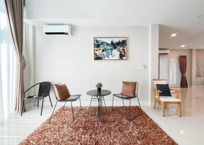 Modern living room with seating area and wall art