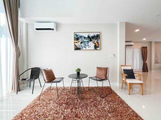 Modern living room with seating area and wall art