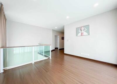 Spacious living area with wooden flooring and modern design