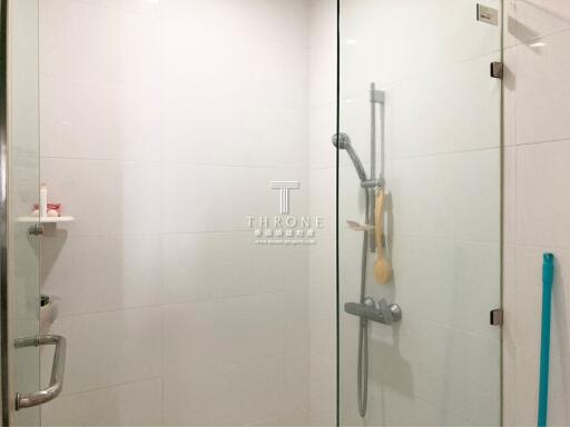 Modern bathroom shower area with glass enclosure