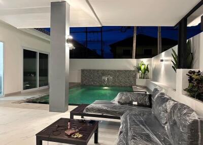 Outdoor living space with pool