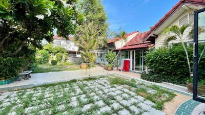 Spacious backyard with trees and greenery