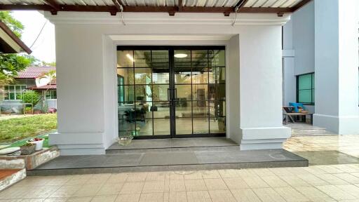 Front entrance of a building with glass double doors