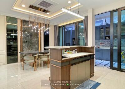 Modern kitchen with breakfast bar and dining area