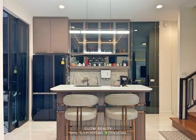 Modern kitchen with island and bar stools