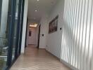 Bright hallway with wooden flooring and modern decor