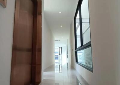 Modern hallway with elevator and large windows