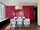 Modern dining room with glass table and six upholstered chairs