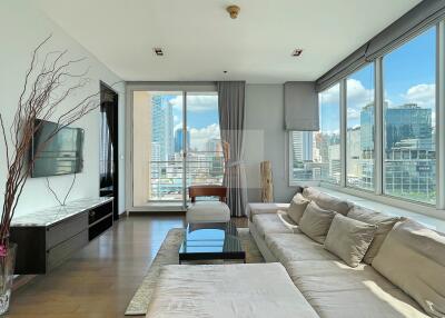 Modern living room with large windows and city view