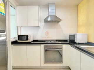 Modern white kitchen with appliances