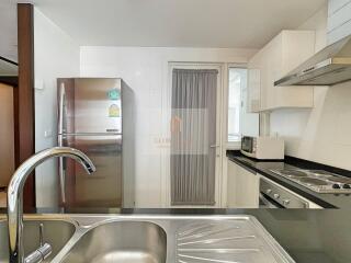 Modern kitchen with stainless steel appliances and sleek countertops